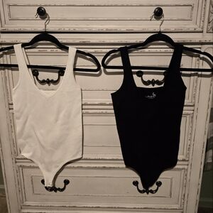 Free people body suits.   M/l.  Tried on, never worn.